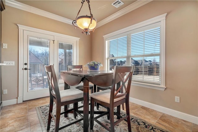 dining room featuring ornamental molding