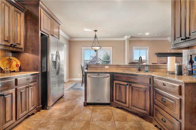 kitchen featuring light stone countertops, sink, stainless steel appliances, backsplash, and crown molding