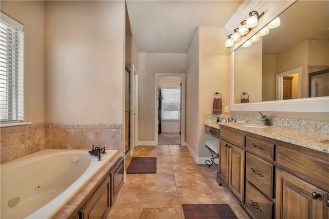 bathroom featuring tile patterned flooring, vanity, and separate shower and tub