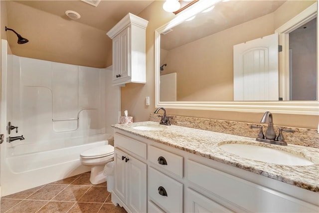 full bathroom with tile patterned floors, toilet, vanity, and tub / shower combination