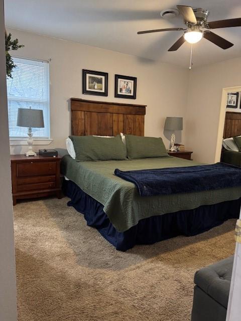 carpeted bedroom with ceiling fan