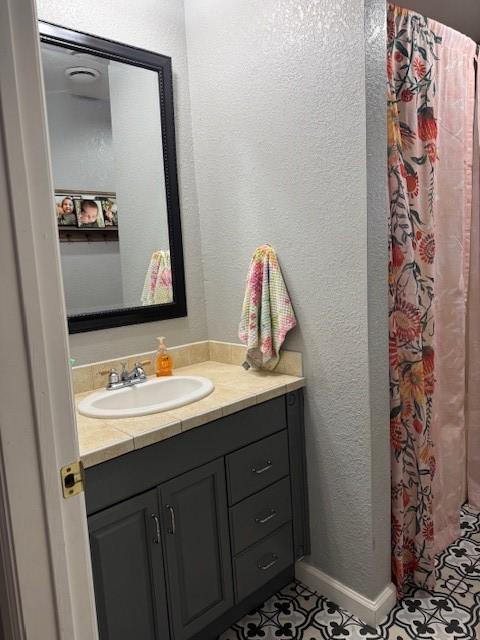 bathroom featuring vanity and tile patterned floors