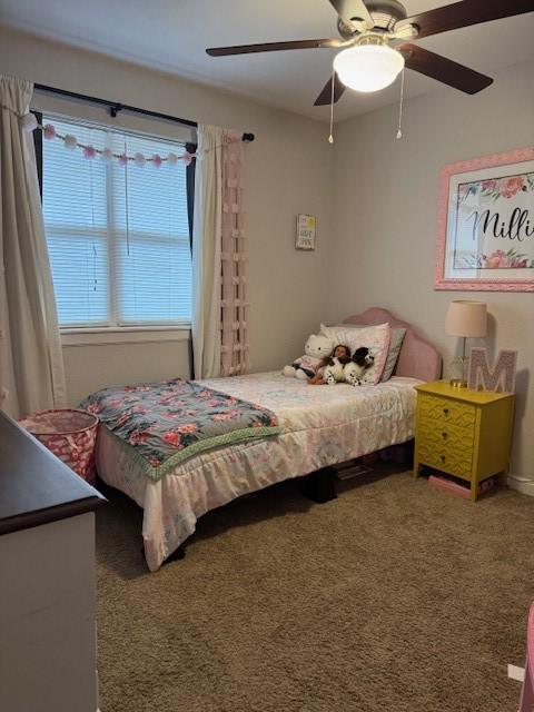 carpeted bedroom featuring ceiling fan