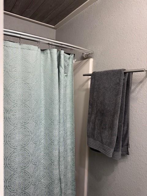 bathroom featuring wooden ceiling