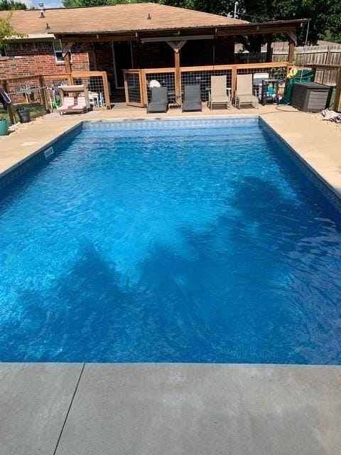 view of swimming pool with a patio