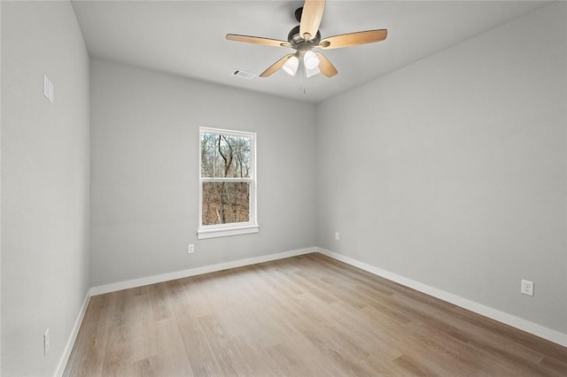 spare room with ceiling fan and light hardwood / wood-style floors