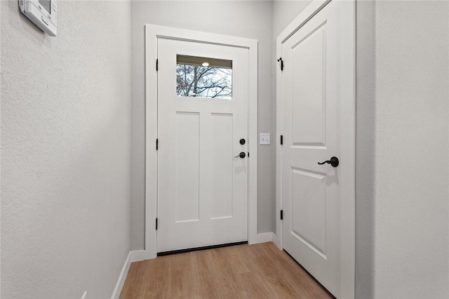 entryway with light hardwood / wood-style flooring