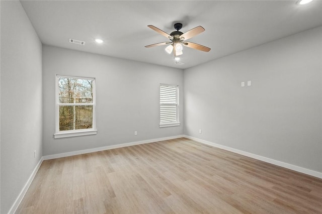 unfurnished room featuring ceiling fan and light hardwood / wood-style flooring