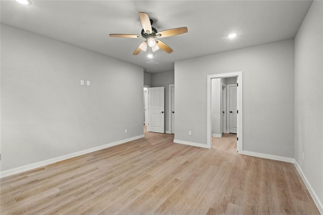 unfurnished bedroom with ceiling fan and light wood-type flooring