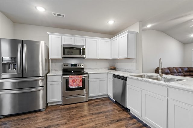 kitchen with sink, white cabinets, and stainless steel appliances