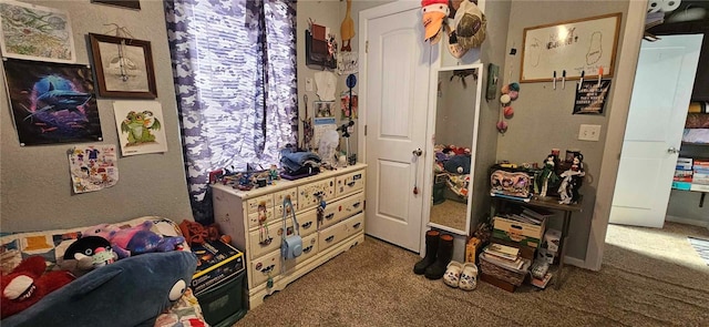 bedroom with dark colored carpet