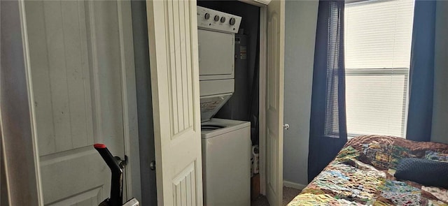 washroom with stacked washer and clothes dryer