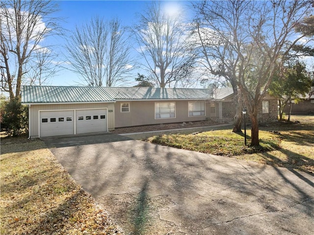 ranch-style house with a front lawn and a garage