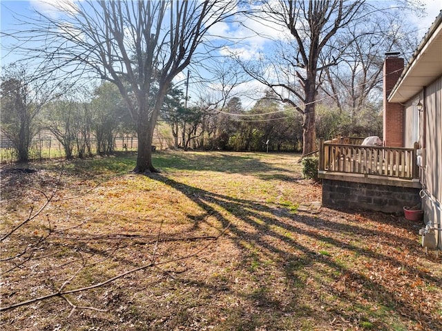 view of yard with a wooden deck