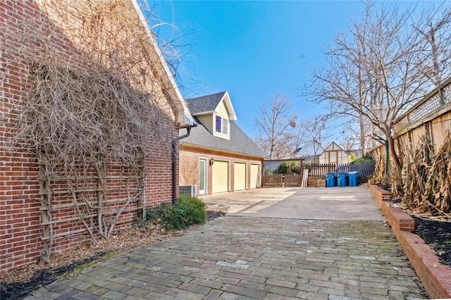 view of property exterior featuring a garage