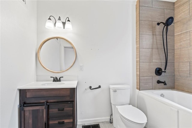 full bathroom with vanity, tiled shower / bath combo, and toilet