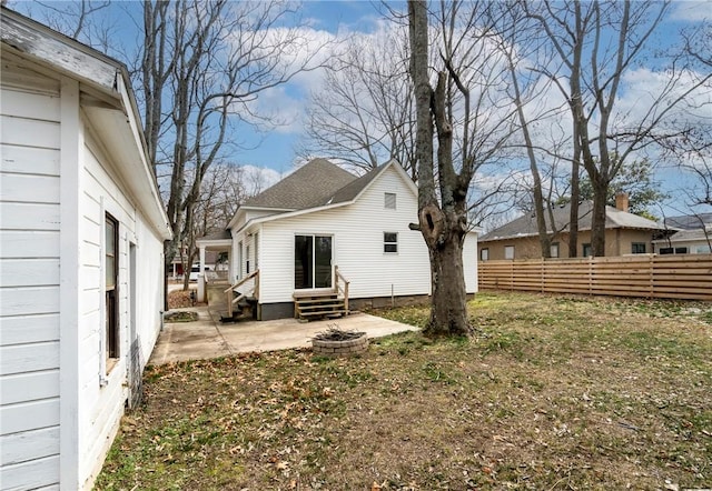 back of property featuring an outdoor fire pit and a patio area