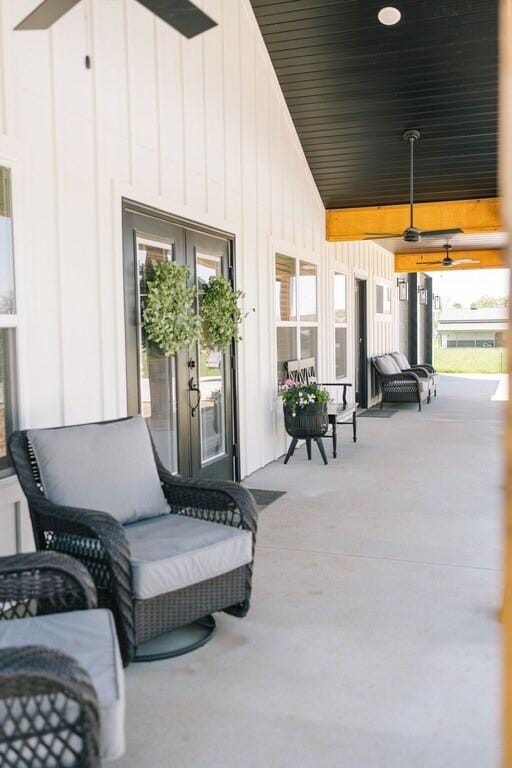 view of patio featuring french doors and a porch