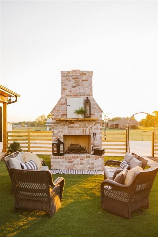 exterior space featuring an outdoor living space with a fireplace