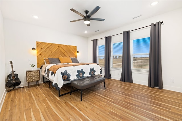 bedroom featuring ceiling fan and hardwood / wood-style flooring