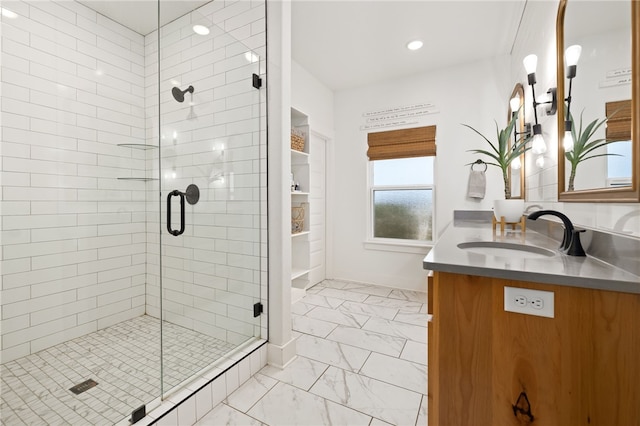 bathroom with an enclosed shower and vanity