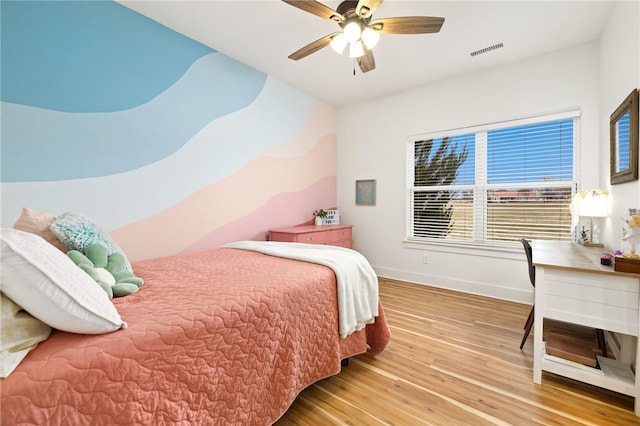 bedroom featuring ceiling fan and wood-type flooring