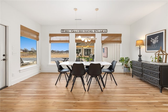 dining space featuring light wood-type flooring