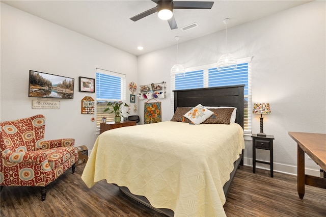 bedroom featuring ceiling fan and dark hardwood / wood-style floors