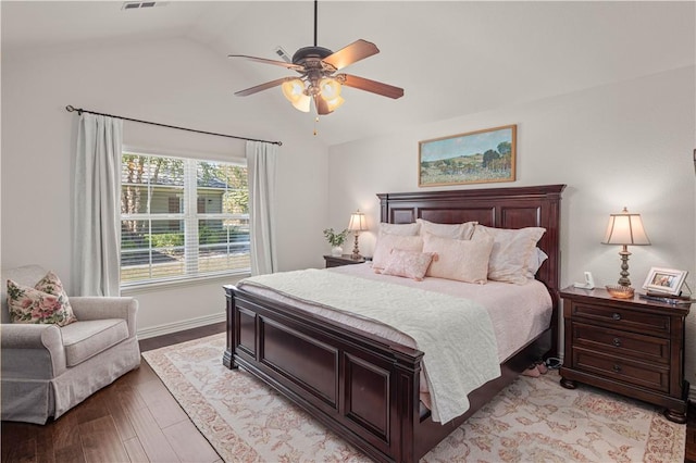 bedroom with ceiling fan, lofted ceiling, and light wood-type flooring