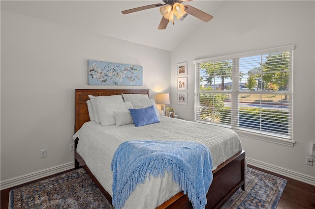 bedroom with ceiling fan, dark hardwood / wood-style floors, and lofted ceiling