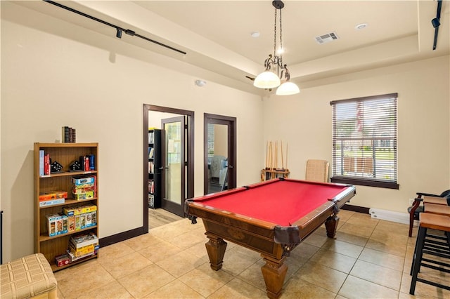 recreation room with light tile patterned flooring, a raised ceiling, and billiards