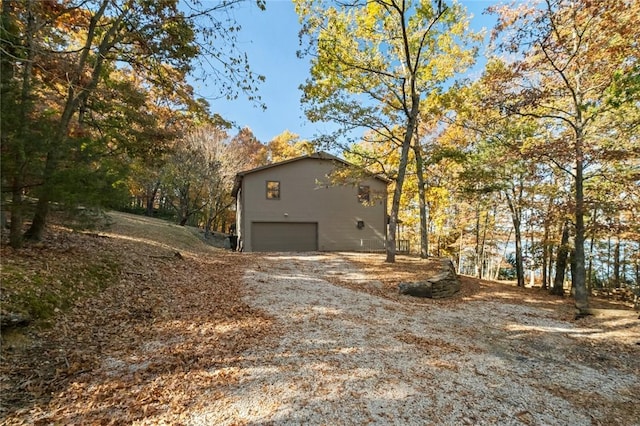 view of side of home featuring a garage