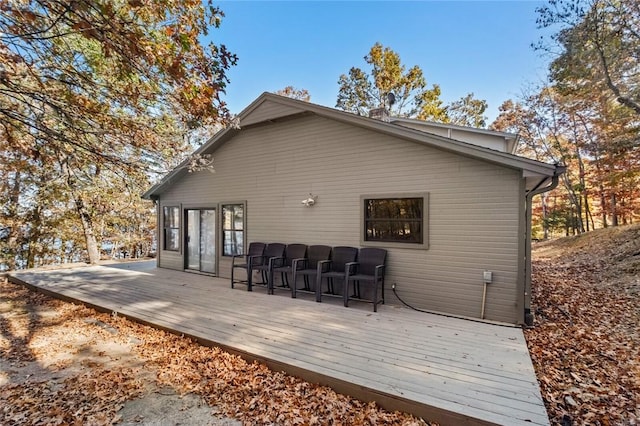 rear view of house with a wooden deck