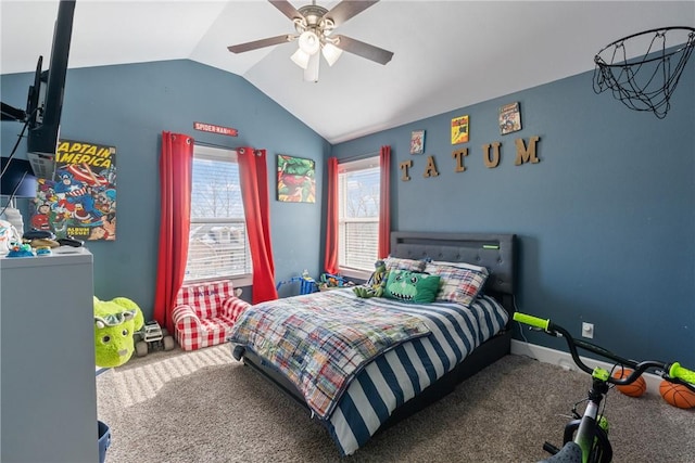 carpeted bedroom featuring ceiling fan and vaulted ceiling