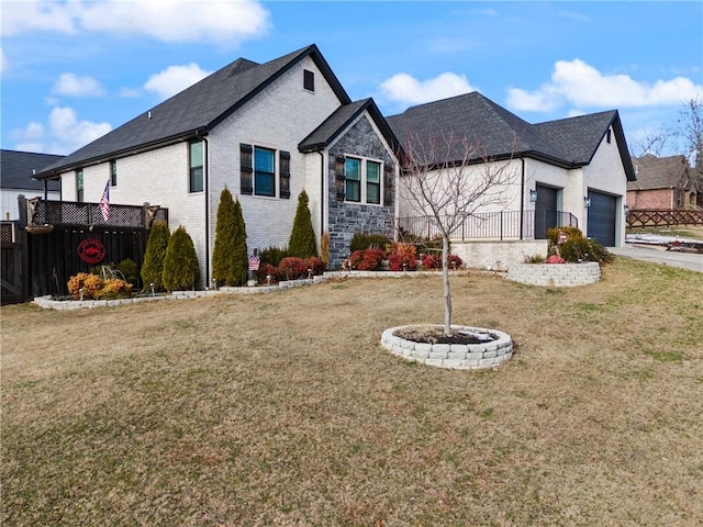 view of front facade featuring a front yard and a garage