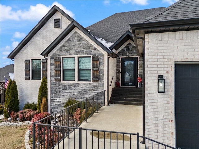 doorway to property with a garage