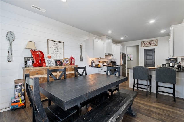 dining area featuring dark hardwood / wood-style floors