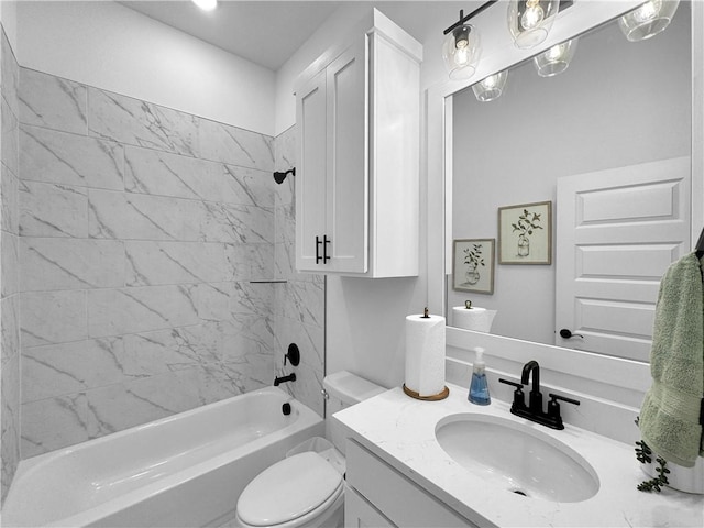 bathroom featuring toilet, vanity, and washtub / shower combination