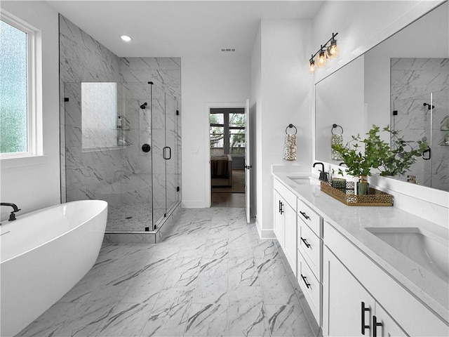 ensuite bathroom featuring visible vents, marble finish floor, a marble finish shower, and a sink