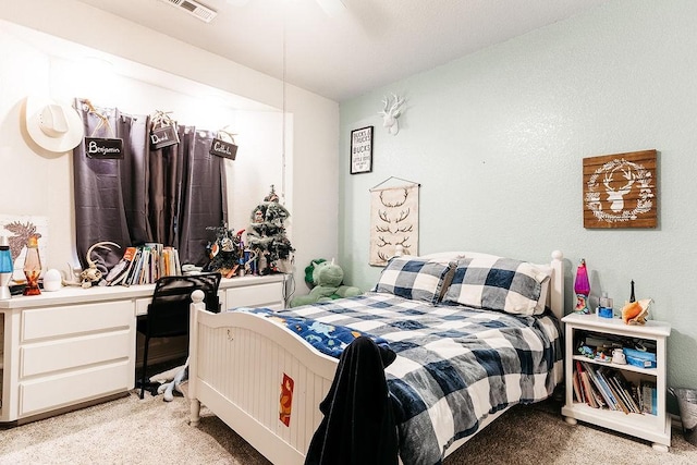 carpeted bedroom with ceiling fan