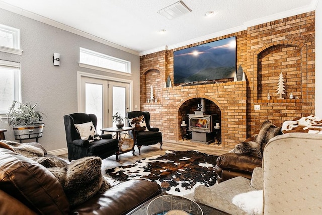 living room with a wood stove, ornamental molding, and brick wall