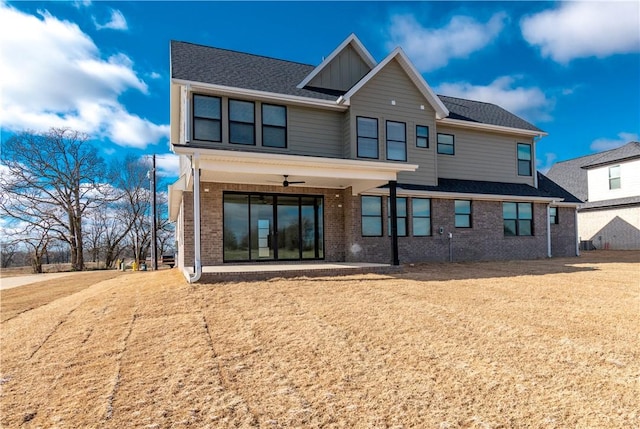 rear view of property with ceiling fan