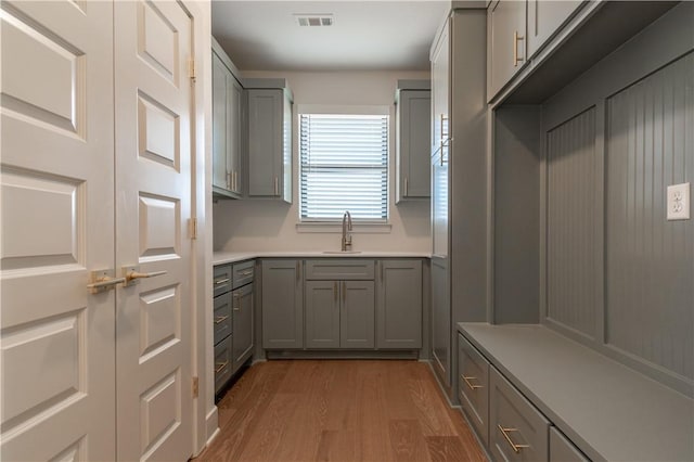 interior space with wood-type flooring and sink