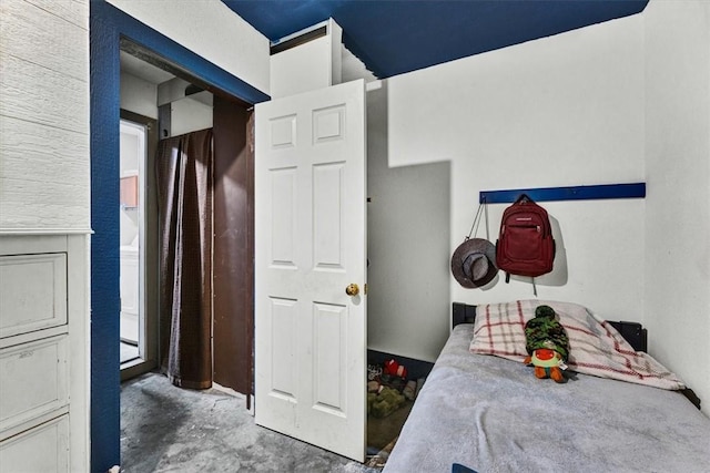 bedroom with concrete floors