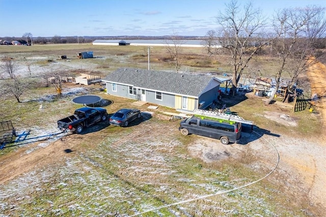 birds eye view of property featuring a rural view