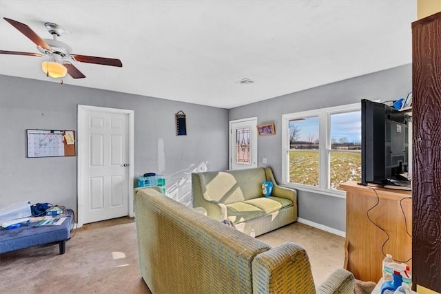 living room with light carpet and ceiling fan