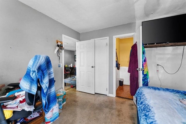 bedroom with concrete flooring