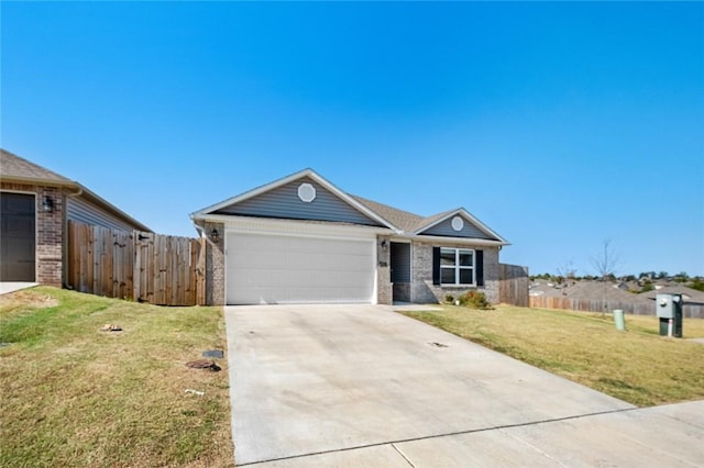 ranch-style home featuring a front yard and a garage