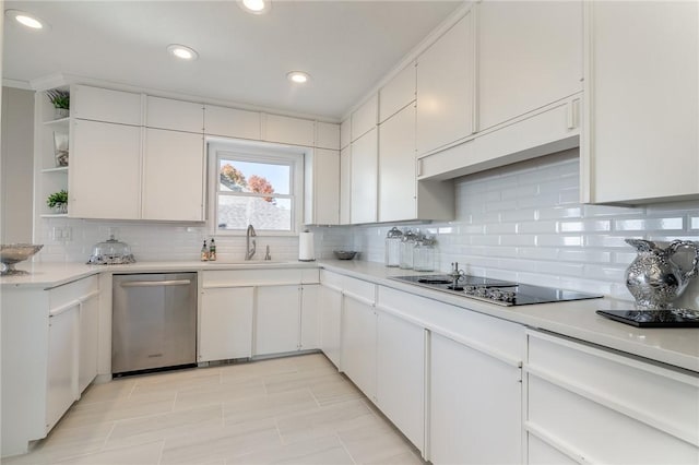 kitchen with tasteful backsplash, black electric cooktop, white cabinetry, and stainless steel dishwasher