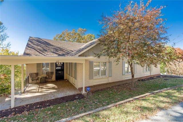 rear view of house featuring a carport